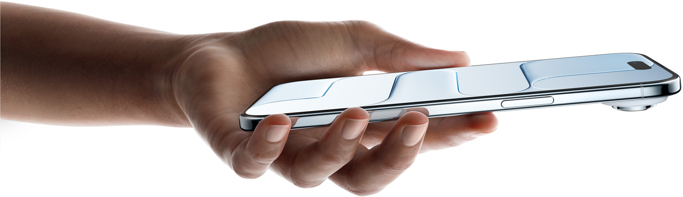 Vista frontal e lateral de uma mão a segurar o iPhone Air, na cor azul-céu, perfil ultrafino, Dynamic Island e os seguintes botões: lateral e Controlo da câmara